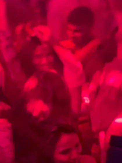 The dance floor is washed in red light at Happy Brew. The energy for our new Tuesday night is growing every week.