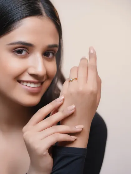 A smiling portrait from the same jewelry shoot, associating the product with happiness and satisfaction.