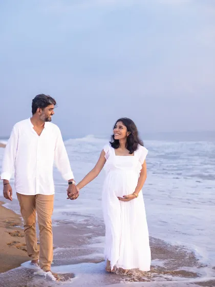 A peaceful walk along the water's edge. The simplicity of the white dress and the natural setting makes for a timeless and beautiful image.
