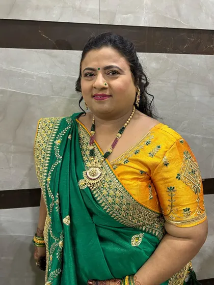 Another angle of the bride's mom's makeup. The focus is on clean skin and a pretty lip color.