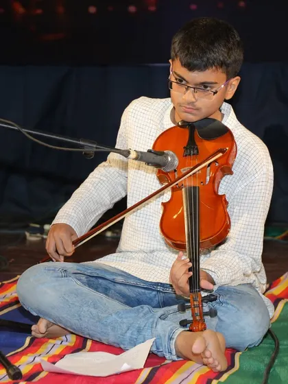 This shot captures Amogh's excellent posture and bowing technique, fundamentals that are stressed in our violin classes.