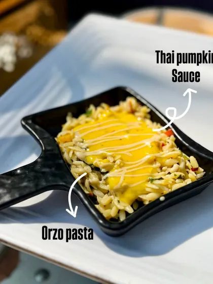 My Parolina Orzo in Thai Pumpkin Sauce is a creamy and comforting fusion pasta dish. The small, rice-shaped orzo pasta is cooked in a sweet and savory Thai-inspired pumpkin sauce.