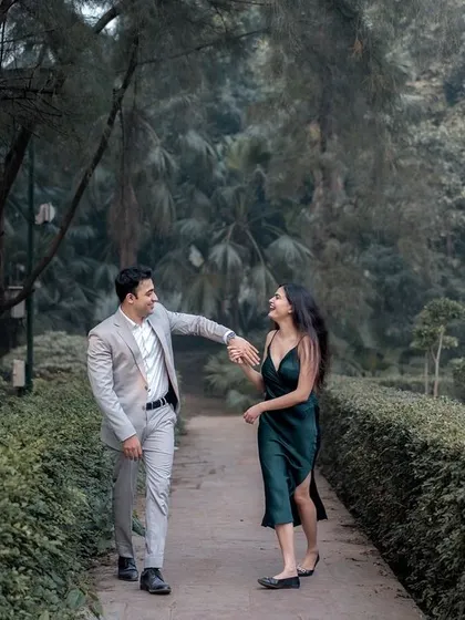 A playful, walking shot on a garden path. The candid interaction and natural smiles are what I strive to capture in every pre-wedding photoshoot.