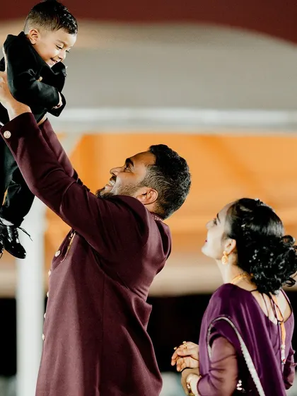 A beautiful, candid moment of the birthday boy being lifted into the air by his father. These are the joyful memories that a fun-filled celebration is all about.