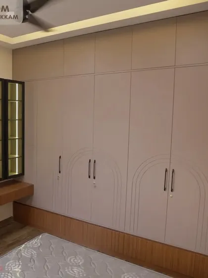 A duplicate image of the elegant master bedroom wardrobe and dressing unit in the Ayyapakkam villa.