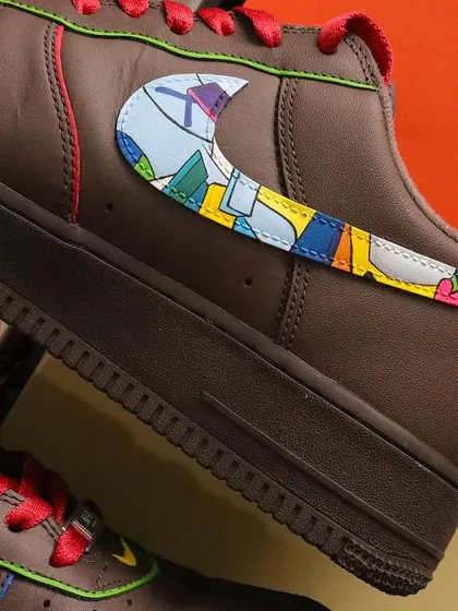 A close-up of the Kaws-inspired swoosh on the Scrooge McDuck sneakers. I filled the Nike logo with a colorful abstract pattern that is characteristic of the famous street artist's work.