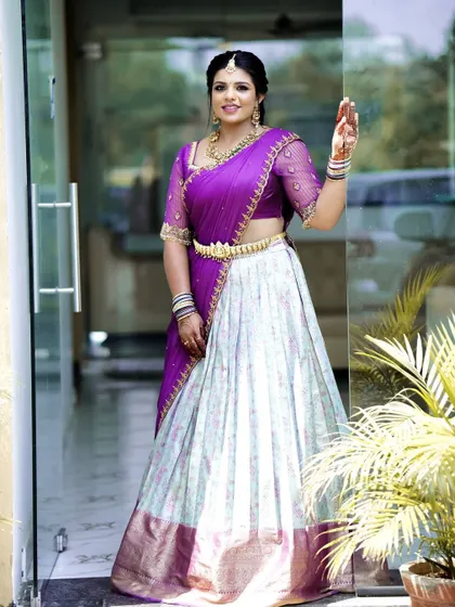 A full-length view of the silk saree skirt, showing how the original drape and border of the saree are reimagined into a modern lehenga silhouette. It’s a perfect outfit for pre-wedding functions like the Sangeet or Mehendi.