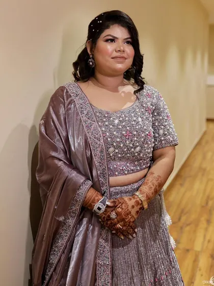 A full-length view of her beautiful lehenga for the anniversary party. The makeup is polished and elegant.