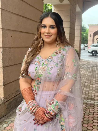 Another angle of this lovely Roka look, showing the intricate details of her outfit and her radiant makeup.