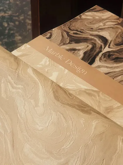 Our marble design wallpapers come in a variety of tones, from dark and dramatic to light and airy. This image shows two contrasting options, perfect for creating different moods while maintaining a sense of luxury.