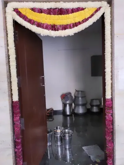 A very simple door decoration with a three-color flower toran. Perfect for small functions or to mark a festive day at home.