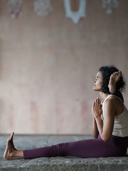 This seated posture, Eka Pada Sirsasana, requires patience and dedication. It teaches me that the journey of growth is not about a giant leap, but about the small, consistent steps we take each day on the mat.