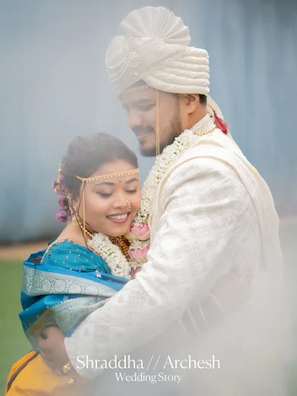 A soft and dreamy portrait of the bride and groom embracing, with a beautiful hazy effect that adds to the romance.