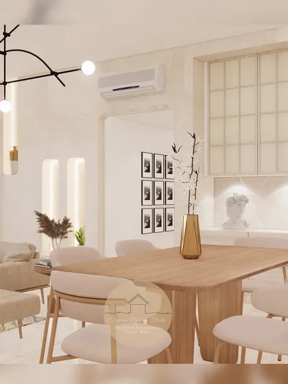 A serene and elegant dining space designed with a neutral palette. The light wood table, upholstered chairs, and minimalist decor create a calming atmosphere perfect for both everyday meals and special occasions.