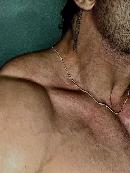 Thirst "Traps". A close up on my trapezius muscles, which are a sign of serious heavy lifting, particularly deadlifts and shrugs.