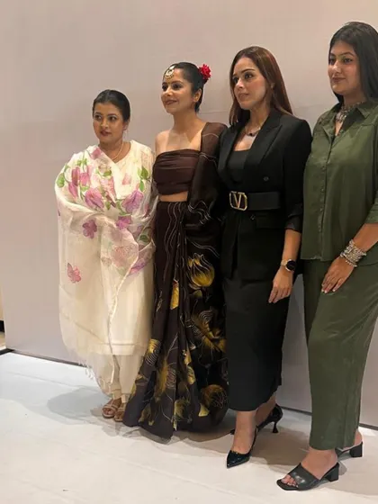 Posing with my styling team and one of the models. Teamwork is essential to pulling off a successful fashion show.
