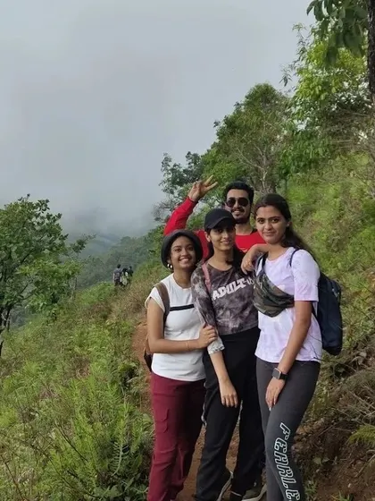 A small group of friends and colleagues enjoying the trail on their way up Netravati Peak.