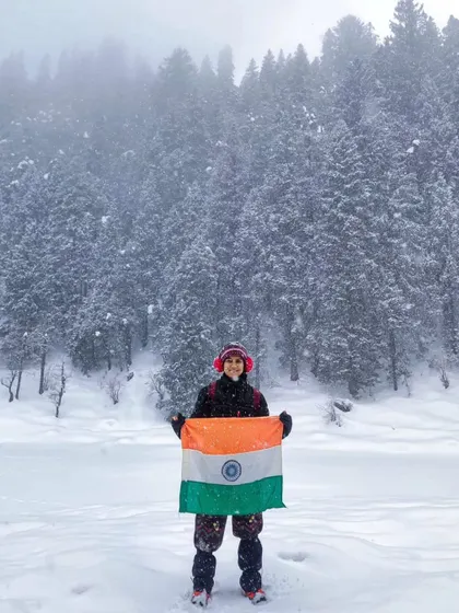 A moment of pride on the Kedarkantha Trek. The feeling of accomplishment amidst the snow-covered pines is something we love helping our travelers experience.