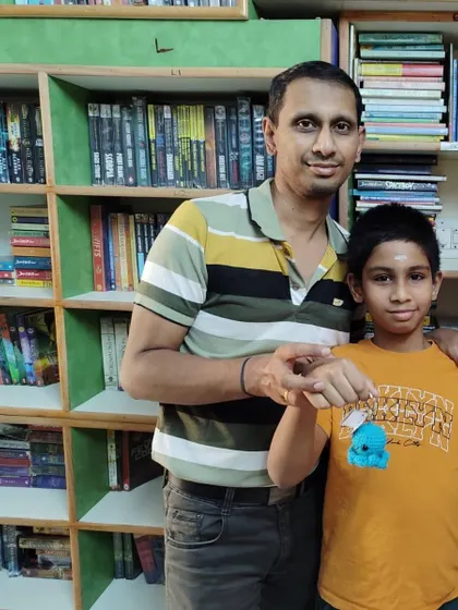 A proud father and son moment! After finishing a reading challenge, this young reader receives his well-earned reward. We love celebrating every reading milestone with our families.