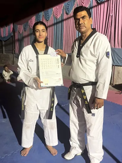 Another proud moment, presenting Aalya Gupta with her black belt certificate. This is the culmination of years of training.