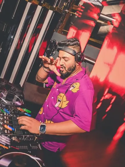 In my element, wearing a funky shirt and fully focused on the mix. This is the Kamra on decks experience.