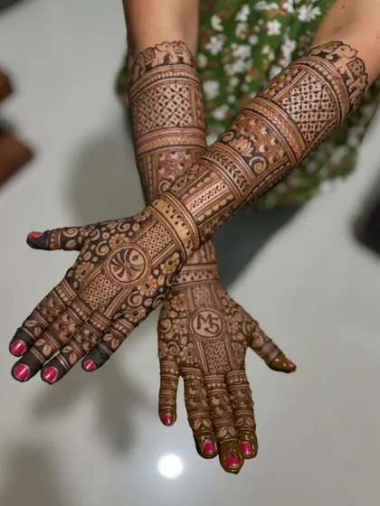 A full bridal design personalized with the couple's initials "MS" and a Swastika symbol.