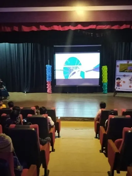 Students gather in the school auditorium for a special screening and presentation to celebrate National Space Day, honoring human curiosity and scientific achievement.