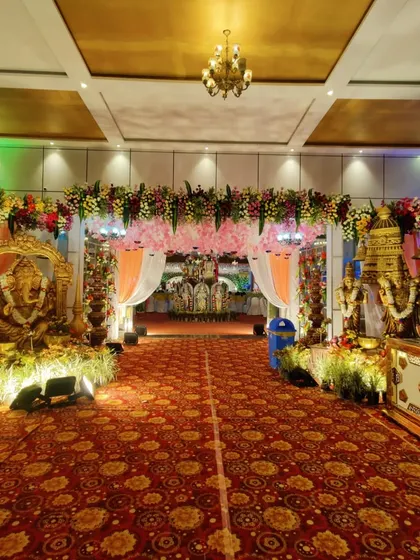 Another view of the royal wedding entrance, showing the beautiful lighting and the depth of the floral arrangements. Every detail is planned to create a magnificent first impression.
