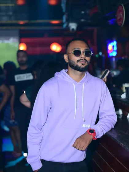 Be as good as you can be. A stylish shot in a purple hoodie, capturing my cool and confident persona.