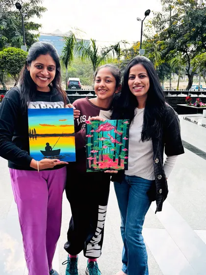 Three happy painters with their finished canvases. It's so rewarding to see the variety of styles that emerge in every workshop.