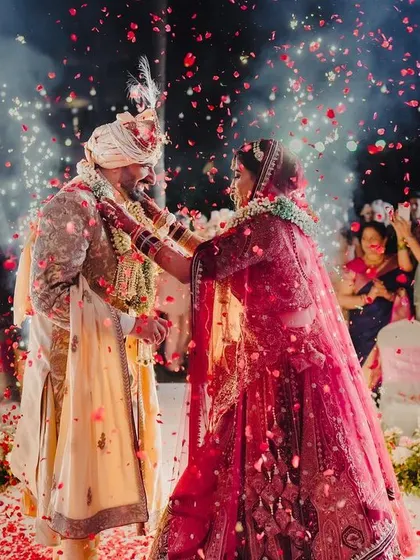 A magical Varmala exchange, with the couple surrounded by family and a shower of flower petals.