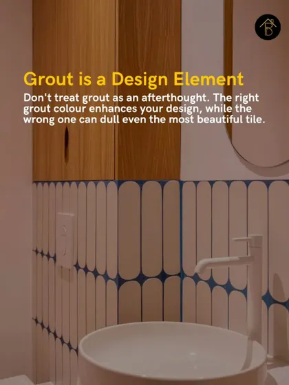 Grout is a critical design element, not an afterthought. The right grout color can enhance your tile design, like this blue grout that creates a stunning graphic pattern with white vertical tiles.