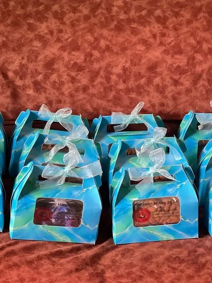 Rows of identical favor boxes, showcasing my capacity to handle large-scale orders for wedding return gifts or corporate events.