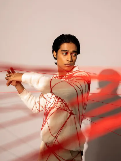 A conceptual men's grooming look for a fashion photoshoot. I kept the makeup minimal and the hair sleek to work with the creative concept involving red thread.