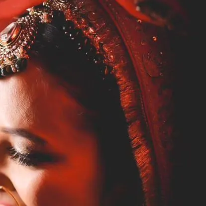 A close-up, artistic shot of a bride's eye makeup, showing the delicate details of her look.