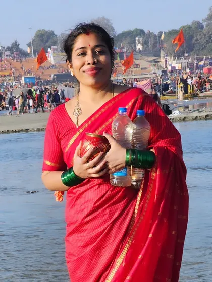 Carrying the holy Ganga water collected from the Sangam. I provide practical tips for pilgrims attending the Kumbh Mela.