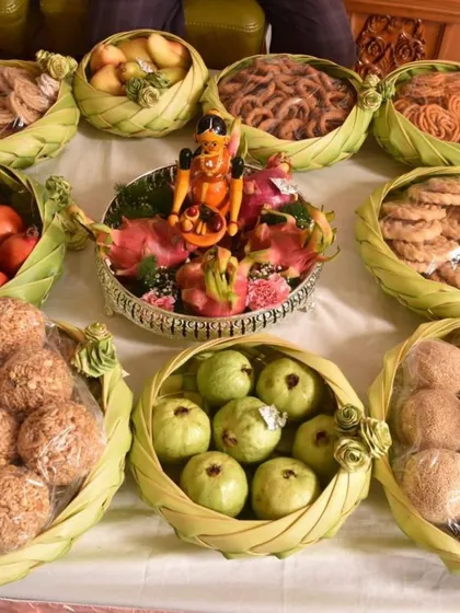 For traditional ceremonies, I prepare offerings of fruits and sweets in eco-friendly leaf baskets. This display includes fresh guavas, pomegranates, and homemade snacks, all ready for a puja or gift exchange.