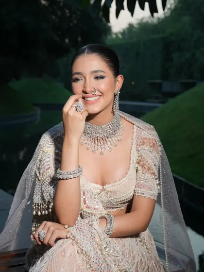 The happiness of a bride is the best accessory. This candid shot shows how a perfectly styled outfit can make a bride feel comfortable and radiant.