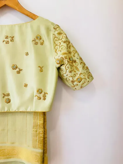 A duplicate image of the elegant pistachio green hand-embroidered blouse.