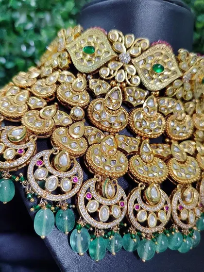 An incredibly detailed and heavy kundan and polki choker from my rental collection. The layers of crescent motifs and green bead drops create a look of pure opulence.