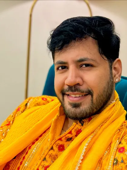 Another portrait in the yellow kurta, this time with a relaxed and warm smile. It shows my approachable and friendly personality.