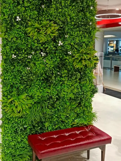 A breath of nature within refined walls. This verdant green wall in a retail space offers a moment of serenity and sophistication for shoppers.