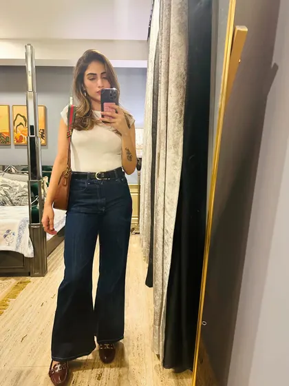 A classic look with a white t-shirt and flared jeans.