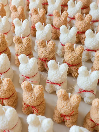 Another view of the adorable Rose Bear candles, all lined up before being packaged for the baby shower.