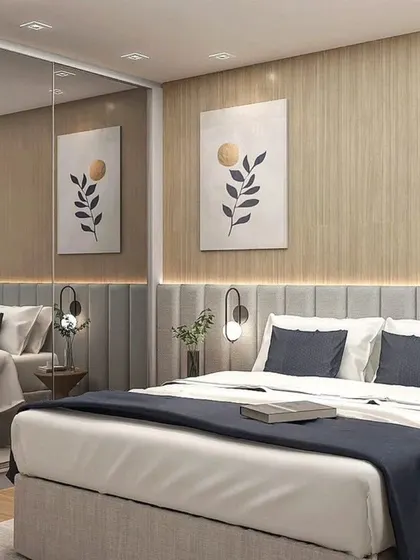 This bedroom uses a large mirror to create an illusion of space, reflecting the bed and the artwork.