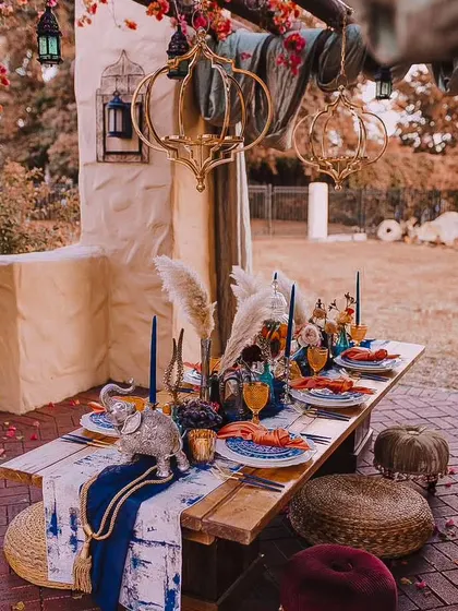 I can create an exotic Moroccan-themed dinner party right in your home or backyard. This setup features rich colors, patterned textiles, ornate lanterns, and authentic decor to transport your guests.