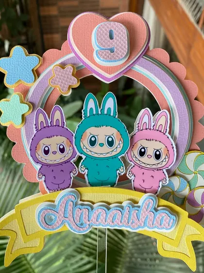 The details on our handmade Labubu topper, from the scalloped frame to the tiny stars and lollipops, are all crafted with care.