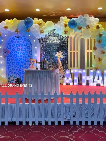 The white picket fence adds a charming touch, creating a designated and safe play area for the little ones in front of the main stage.