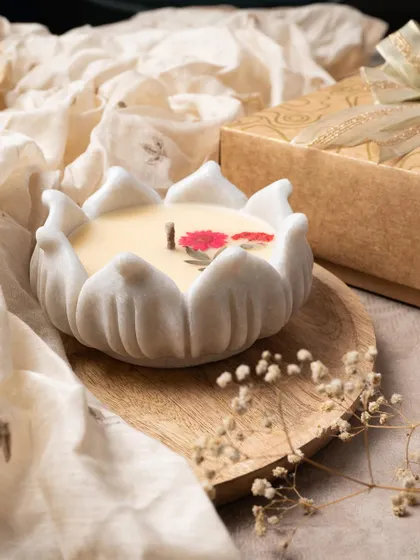 The lotus-shaped marble urli is one of my favorite designs. Filled with scented wax and topped with pressed flowers, it's the epitome of grace.