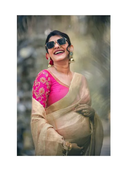 A duplicate of image 57, this shot radiates the pure joy and stylish confidence of the mother-to-be.